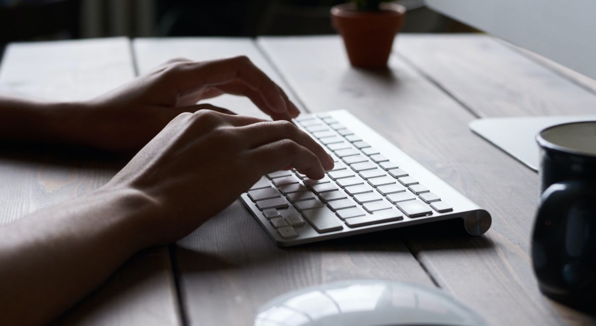 Hands typing on keyboard